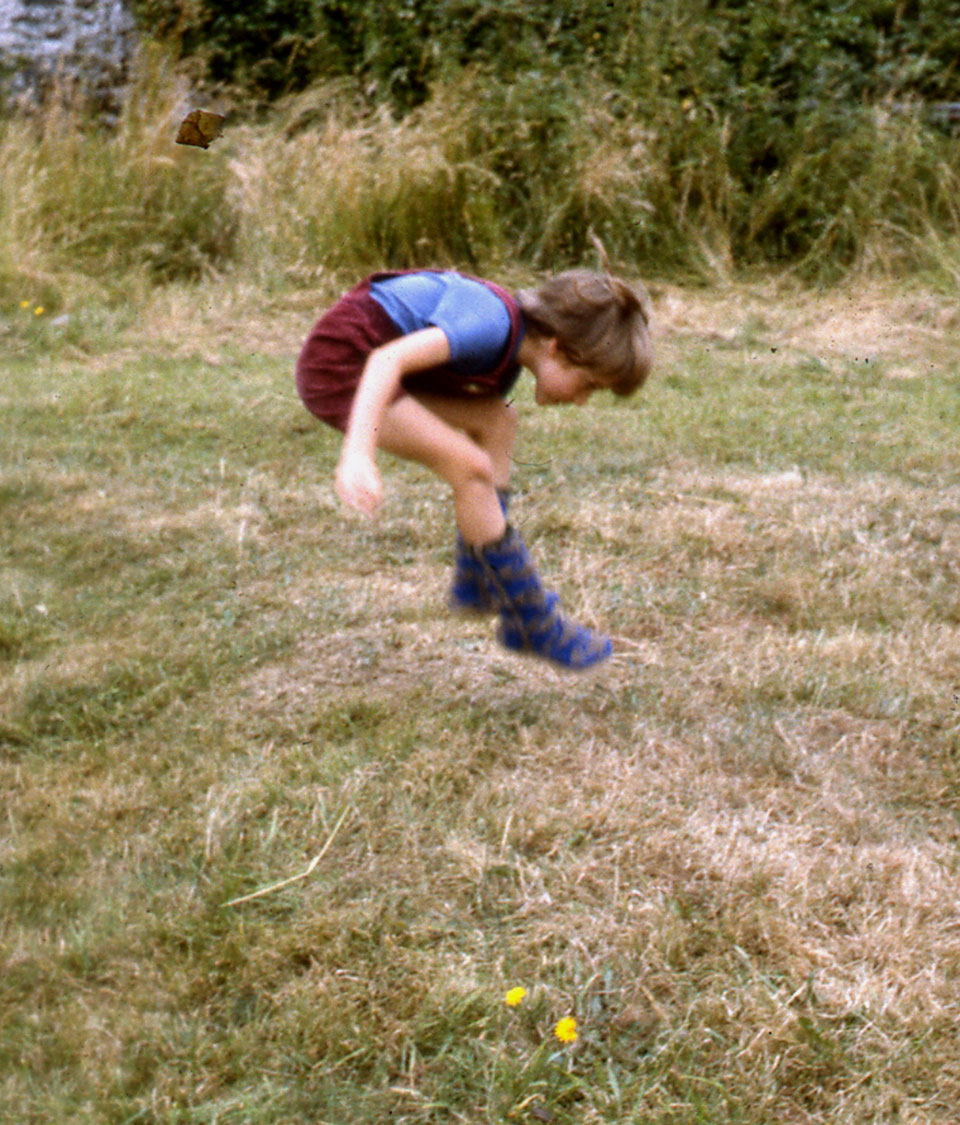 Archi-leaping-high-over-a-yellow-daisey-in-his-Rope-Soled-Socks.-August-1983.jpg